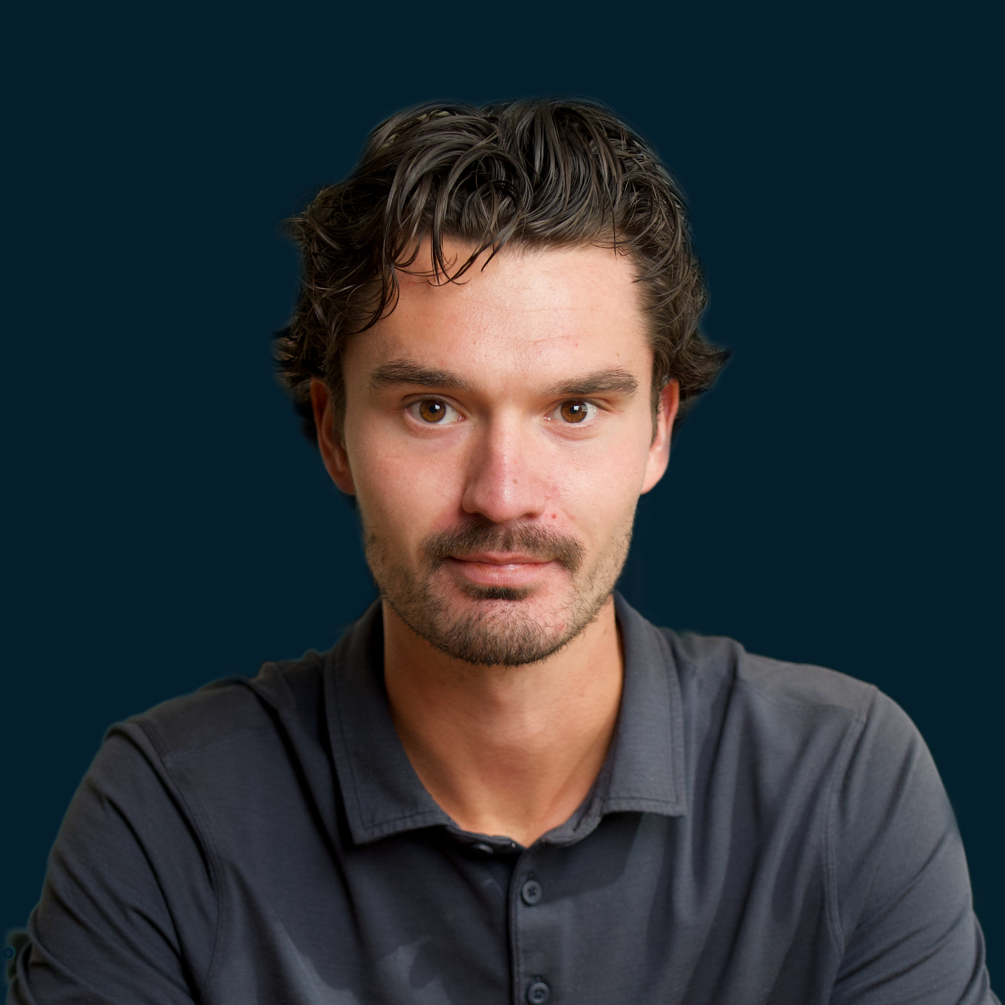 A professional headshot of Ryan Butler.